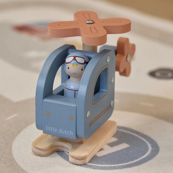 Hélicoptère en bois avec figurine dès 18 mois. Hélice rotative, stimule la motricité et l’imagination.