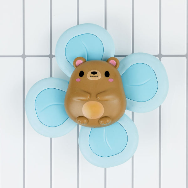 Stimulez les sens de votre bébé avec ce jouet ours rotatif ! Rotation à 4 palettes, ventouse solide, motricité fine et apprentissage par cause à effet. Dès 6 mois.